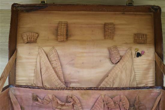 An early 20th century crocodile skin briefcase and a suitcase length 49cm